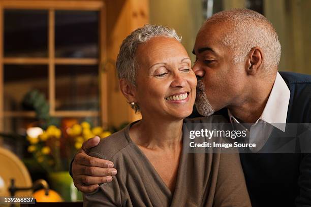 mature couple kissing - man short hair stock pictures, royalty-free photos & images