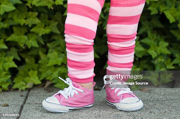 legs of a toddler in pink striped leggings - girls shoes stock pictures, royalty-free photos & images