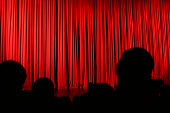 Audience silhouette and curtain