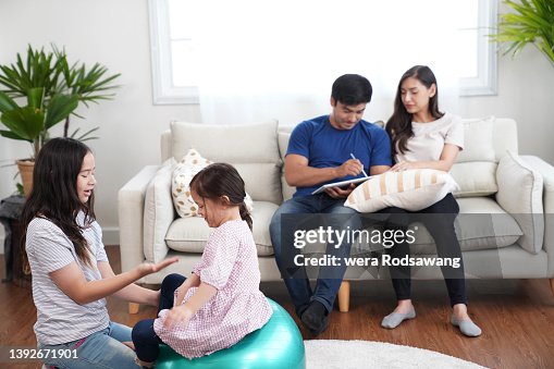 Parentts Family Lifestyle While Stay Home Parents Spending Time Together And ...