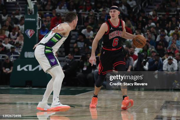 Alex Caruso of the Chicago Bulls is defended by Pat Connaughton of the Milwaukee Bucks in the second half of Game Two of the Eastern Conference First...