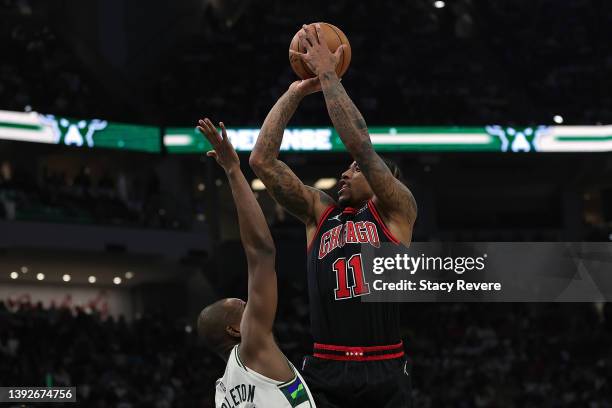 DeMar DeRozan of the Chicago Bulls shoots over Khris Middleton of the Milwaukee Bucks in the first half of of Game Two of the Eastern Conference...