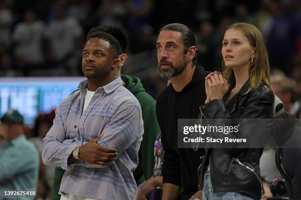 Randall Cobb, Aaron Rodgers and Mallory Edens watch Game Two of the Eastern Conference First Round Playoffs between the Milwaukee Bucks and the...