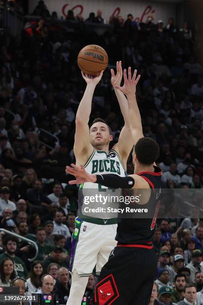 Pat Connaughton of the Milwaukee Bucks shoots over Zach LaVine of the Chicago Bulls in the second half of Game Two of the Eastern Conference First...