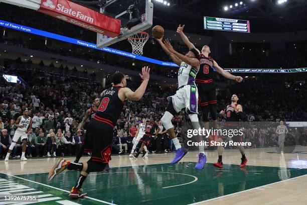 Giannis Antetokounmpo of the Milwaukee Bucks drives to the basket against Alex Caruso of the Chicago Bulls in the second half of Game Two of the...