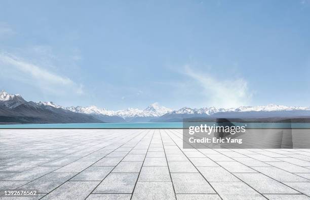 in front of snow mountain - lake pukaki stock pictures, royalty-free photos & images