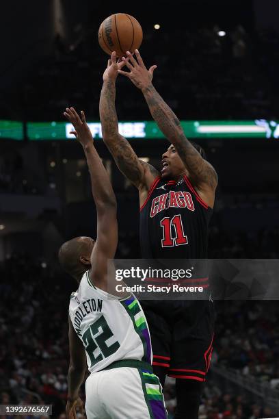 DeMar DeRozan of the Chicago Bulls shoots over Khris Middleton of the Milwaukee Bucks in the first half of of Game Two of the Eastern Conference...