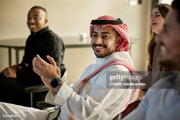 late 20s riyadh businessman showing approval in meeting - saudi women stock pictures, royalty-free photos & images