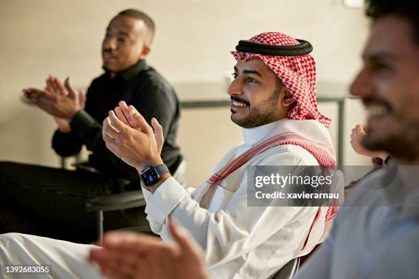 riyadh businessmen clapping at conclusion of presentation - ksa people stock pictures, royalty-free photos & images