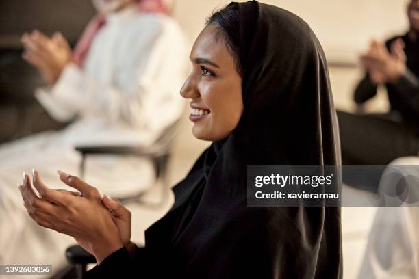 candid portrait of saudi businesswoman showing approval - riyad stockfoto's en -beelden