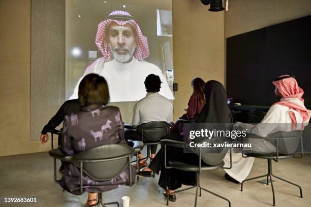 saudi ceo communicating with corporate staff on video call - ksa people stock pictures, royalty-free photos & images