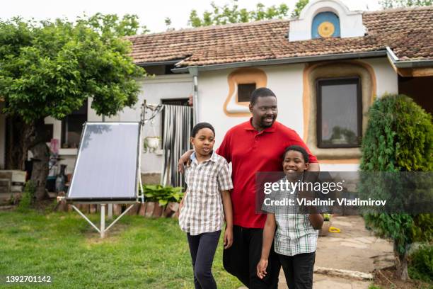 an african-american father going out for a wlak with his daughter and his son - autismus stock pictures, royalty-free photos & images