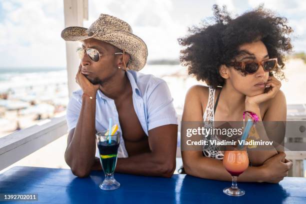 relationship troubles during vacation - friends argue stock pictures, royalty-free photos & images