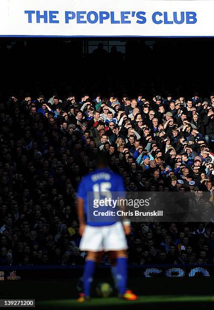 Everton fans watch the action during the FA Cup Fifth Round match between Everton and Blackpool at Goodison Park on February 18, 2012 in Liverpool,...