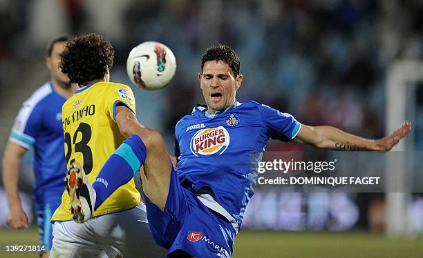 Espanyol's Argentinian midfielder Jesus Datolo vies for the ball with Getafe's midfielder Jaime Gavilan during the Spanish league football match...