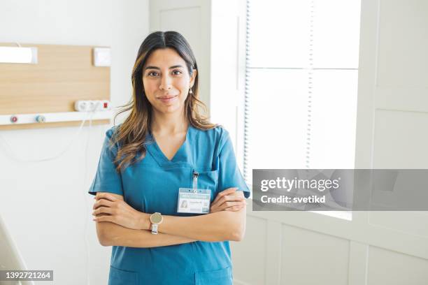 portrait of female nurse at medical clinic. - female nurse bildbanksfoton och bilder