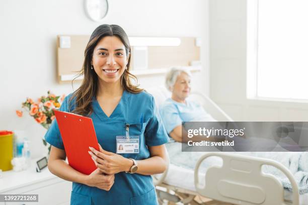 portrait of female nurse at medical clinic. - female nurse bildbanksfoton och bilder