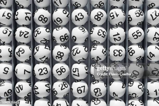 lottery balls stacked in columns - bingo stock-fotos und bilder