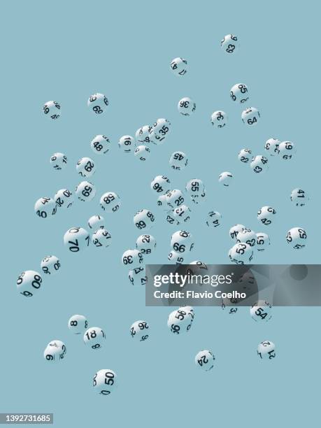lottery balls flying against blue sky - sorte imagens e fotografias de stock
