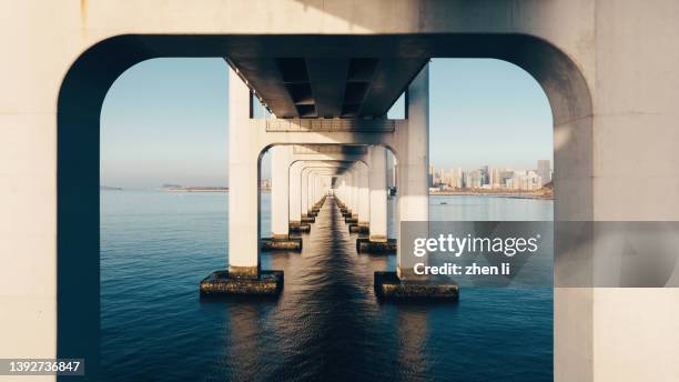 column of the sea crossing bridge - lasting stock pictures, royalty-free photos & images