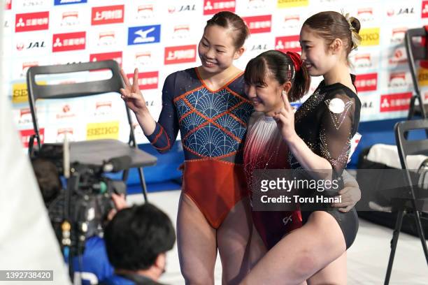 Sae Miyakawa, Asuka Teramoto and Yuki Uchiyama pose for photos after competing during day one of the 76th Japan Artistic Gymnastics Individual...