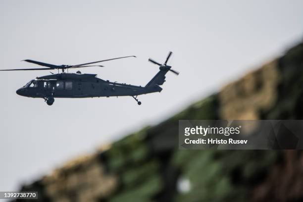 An UH-60 Black Hawk helicopter flies during the demonstrations of the capabilities of the multinational battle group at Novo Selo military ground on...
