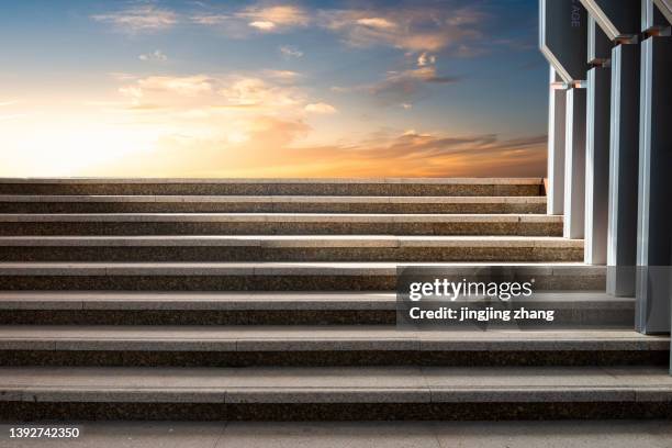 stone steps illuminated by the setting sun on a clear sky - steps and staircases stock pictures, royalty-free photos & images