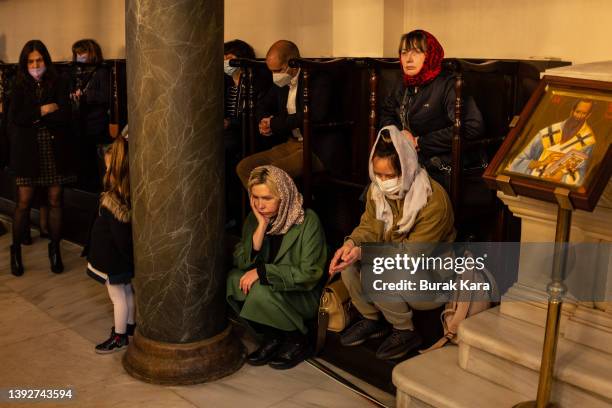 Greek Orthodox faithfuls attend the consecration of the holy myron oil mass as part of Easter celebrations at the Church of Fener Orthodox...