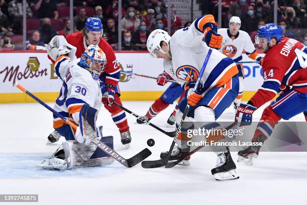 Ilya Sorokin of the New York Islanders makes a save off the shot by the Montreal Canadiens in the NHL game at the Bell Centre on April 15, 2022 in...