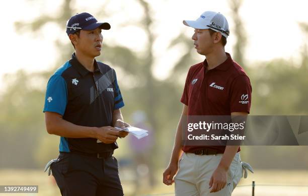 Sangmoon Bae of South Korea with Seung-Yul Noh of South Korea on the third tee during the first round of the Zurich Classic of New Orleans at TPC...