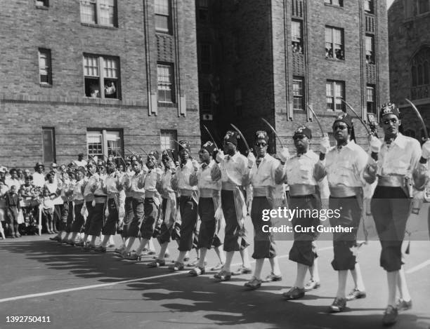 Members of the Mecca Temple of the Ancient Arabic Order of the Nobles of the Mystic Shrine, a Masonic society commonly known as 'Shriners,' marching...