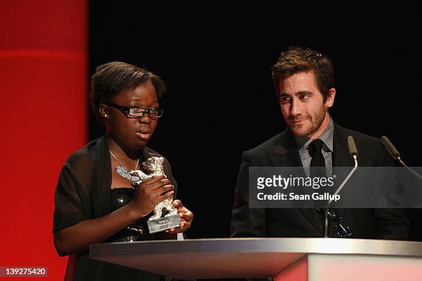 Congolese actress Rachel Mwanza receives the Silver Bear for Best Actress in the film Rebelle by jury member Jake Gyllenhaal at the Closing Ceremony...