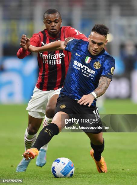 Pierre Kalulu of AC Milan and Lautaro Javier Martinez of FC Internazionale in action during the Coppa Italia Semi Final 2nd Leg match between FC...