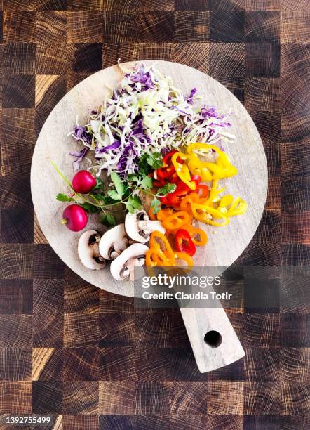 chopped vegetables on cutting board on wooden background - cut cabbage stock pictures, royalty-free photos & images