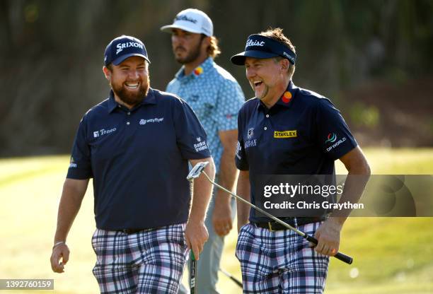 Shane Lowry of Ireland and Ian Poulter of England share a laugh on the 10th green during the first round of the Zurich Classic of New Orleans at TPC...