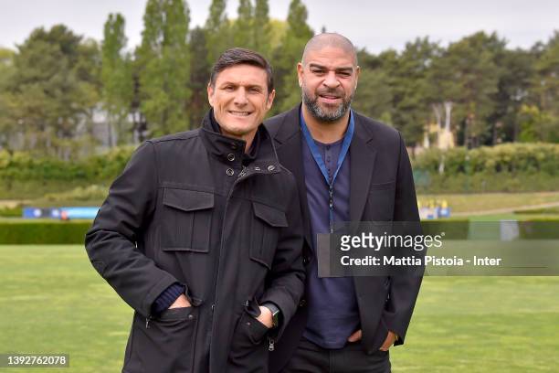 Adriano Leite Ribeiro and Vice President Javier Zanetti of FC Internazionale pose for a picture during the FC Internazionale training session at the...