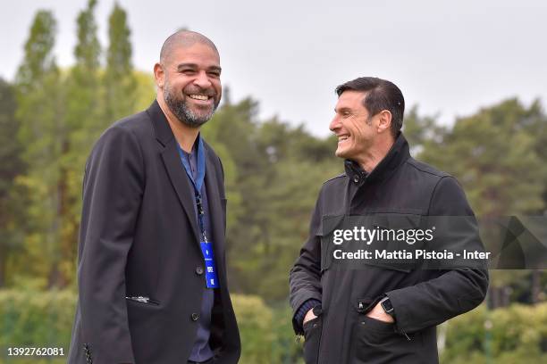 Adriano Leite Ribeiro and Vice President Javier Zanetti of FC Internazionale smile during the FC Internazionale training session at the club's...