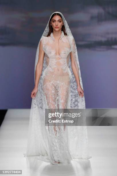Model walks the runway during the Marco & Maria show as part of the Barcelona Bridal Week 2022 on April 21, 2022 in Barcelona, Spain.