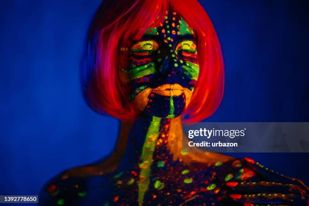 young woman with fluorescent makeup - neon fluorescent hair stock pictures, royalty-free photos & images