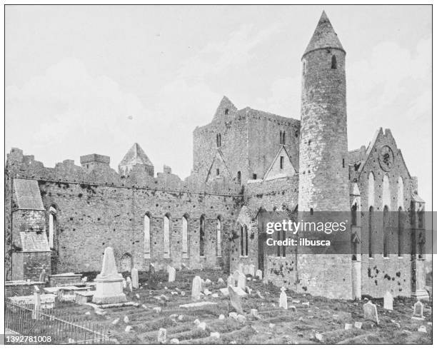 antique photograph of ireland: cashel abbey, round tower - the rock of cashel stock illustrations