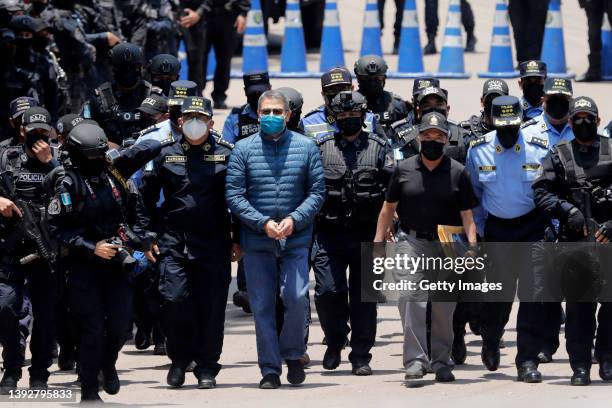 Former President of Honduras Juan Orlando Hernandez is escorted by Members of the Police Special Forces to be extradited to U.S.to face charges of...