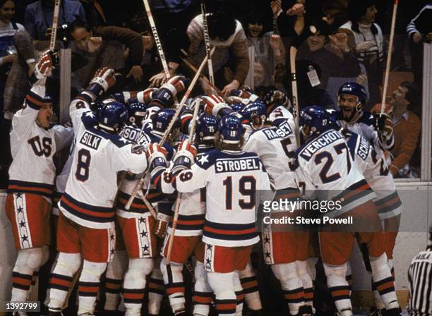 Team USA celebrates their 4-3 victory over the Soviet Union in the semi-final Men's Ice Hockey event at the Winter Olympic Games in Lake Placid, New...