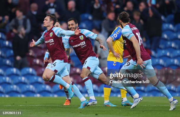 Connor Roberts of Burnley celebrates after scoring their side's first goal with team mates during the Premier League match between Burnley and...