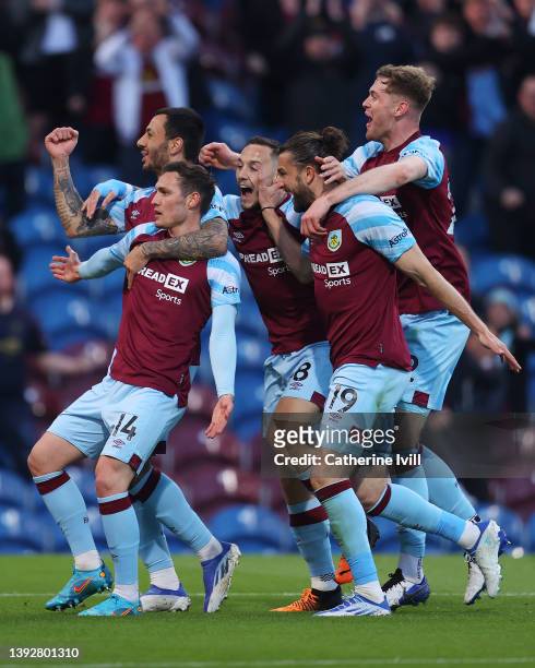 Connor Roberts of Burnley celebrates after scoring their side's first goal with team mates during the Premier League match between Burnley and...
