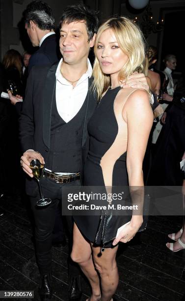 Jamie Hince and Kate Moss attend a cocktail reception at the Stella McCartney Special Presentation during London Fashion Week Autumn/Winter 2012 a...