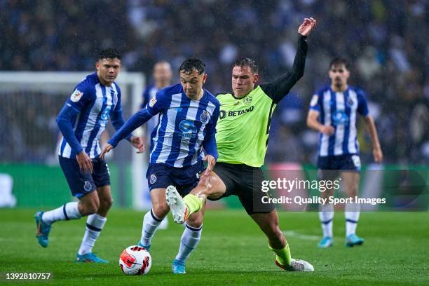Manuel Ugarte of Sporting CP competes for the ball with Eduardo Aquino Cossa 'Pepe' of FC Porto during the Portuguese Cup semifinal match between FC...