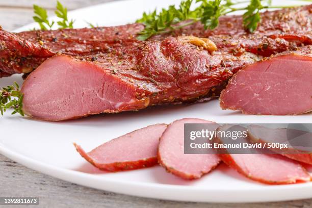 smoked pork sirloin,close-up of meat in plate - sirloin steak fotografías e imágenes de stock