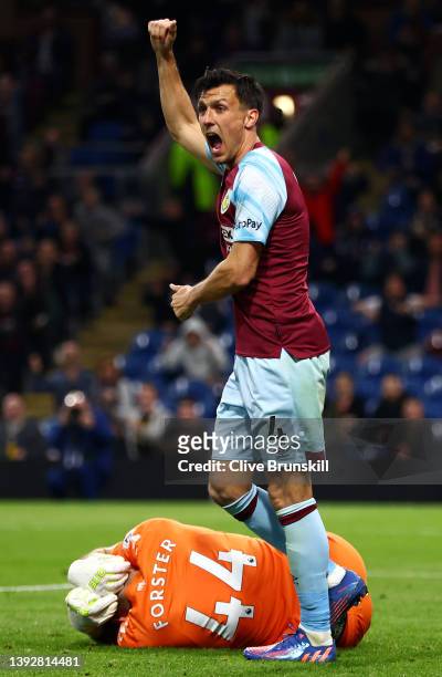 Jack Cork of Burnley celebrates a goal which is later disallowed for offside after a VAR check as Fraser Forster of Southampton appears to be injured...