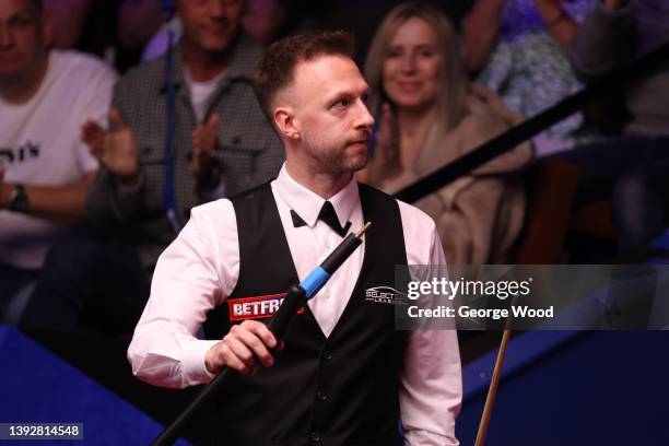 Judd Trump of England celebrates after victory in the Betfred World Snooker Championship Round One match between Judd Trump of England and Hossein...