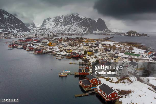 aerial view of the reine fisdherman village bay taken with a drone in winter - lofoten islands - norway - northern europe stock pictures, royalty-free photos & images